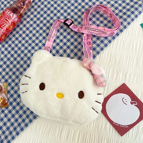 Sac à main ado au design de tête de chatsur une nappe à carreux